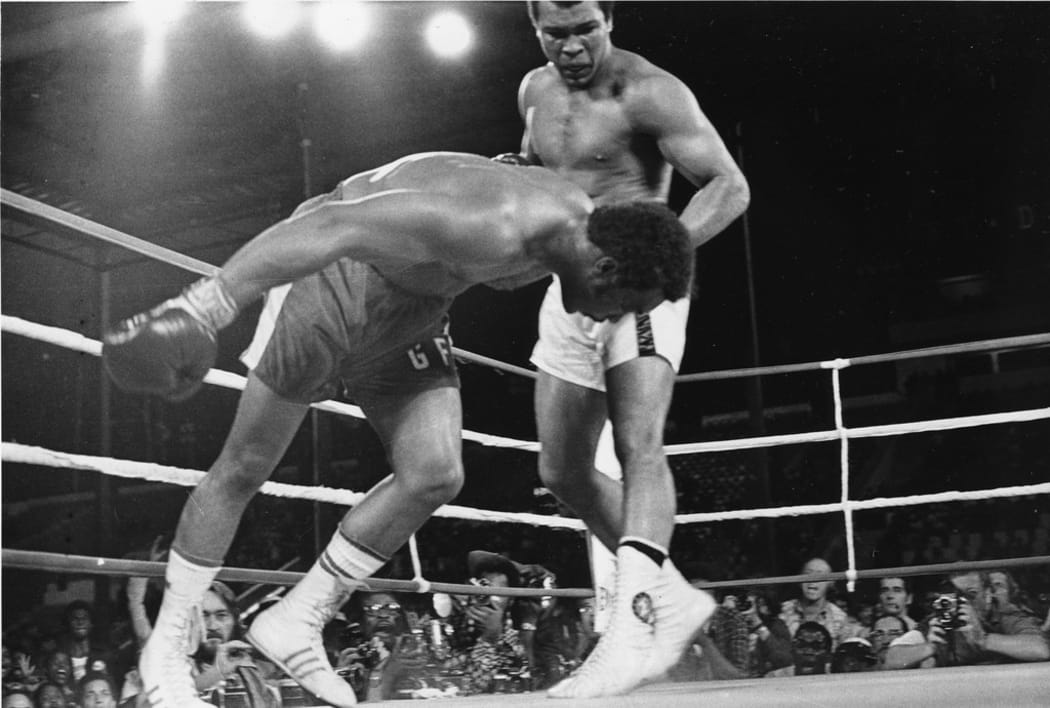 Muhammad Ali fights George Foreman in 1974.
