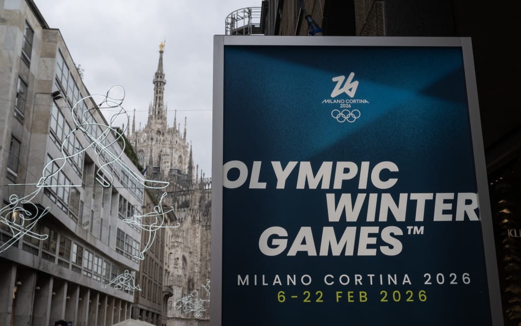 A picture shows a poster of Milano Cortina 2026 Olympic Games in Milan on January 27, 2026. (Photo by MARCO BERTORELLO / AFP)