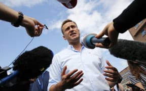 (FILES) This file photo taken on July 20, 2019 shows Russian opposition leader Alexei Navalny speaking with journalists during a rally to support opposition and independent candidates.