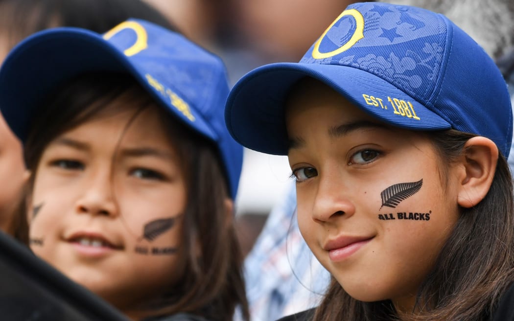 New Zealand supporters pose prior to the Japan 2019 Rugby World Cup Pool B match between New Zealand and Namibia at the Tokyo Stadium in Tokyo on October 6, 2019.