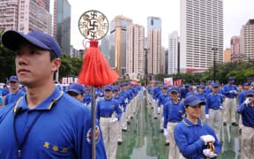 Falun Gong members prepare for a pro-democracy rally in Hong Kong on July 1, 2013.