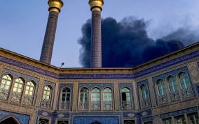 Smoke rises after an explosion occurred in downtown Tehran amid the third day of Israel's military strikes against Iran, Sunday, June 15, 2025. (Photo by Khoshiran / Middle East Images via AFP)