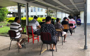 Early birds - Voters in Fiji waiting for the polling station at Suva Grammar to open this morning. 14 December 2022.