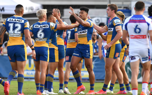 Waqa Blake (centre) of the Eels celebrates scoring a try with team mates during the NRL Elimination Final match between Parramatta Eels and Newcastle Knights at Browne Park in Rockhampton, Sunday, September 12, 2021.