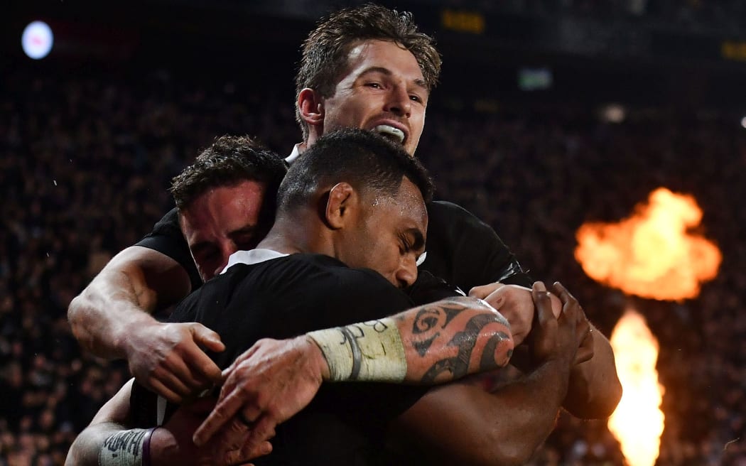 All Blacks Sevu Reece (Front) celebrates a try with team mate George Bridge (Top) and TJ Perenara.