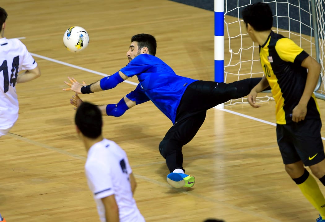 NZ keeper Atta Elayyan makes a save during a futsal international against Malaysia in 2013.