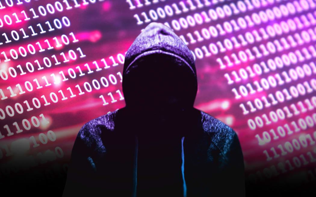 Composite of dark figure in hoodie in front of binary code