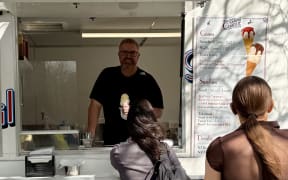 New owner of Ice Cream Charlie Gareth Eddy serves his first ice cream.