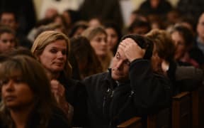 Mourners gather at a vigil service for victims of the Sandy Hook Elementary School shooting.