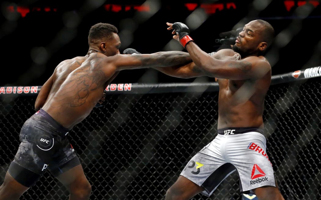 Ninth ranked UFC Middleweight Israel Adesanya (Left) striking Derek Brunson