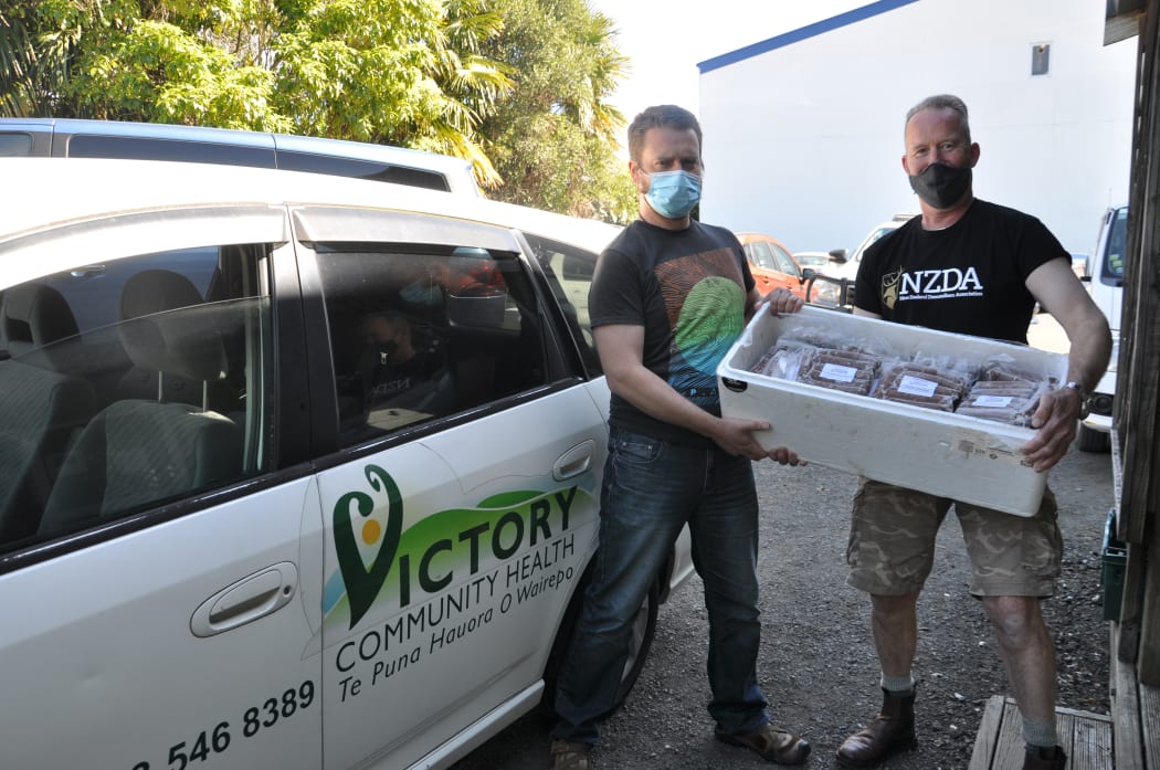 Victory Community Centre coordinator Steve McLuckie and NZDA committee member David Haynes with some of the donated venison.