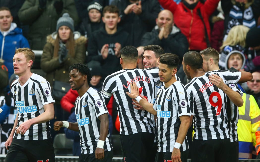 Newcastle United players celebrate.
