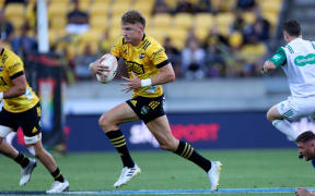 Hurricanes Jordie Barrett runs the ball