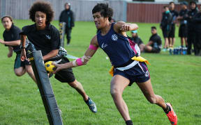 Whanganui City College playing Te Kura o Nga Tapuwae (black uniform) from Mangere in South Auckland.