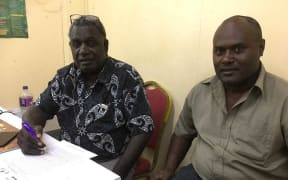 Bougainville's electoral commissioner George Manu, (left), and acting election manager George Kenatsi in February
