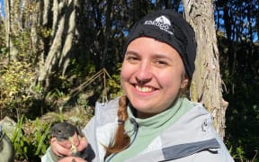 Ecologist and report author Manaia Permain-Fenton with a kakaruai.