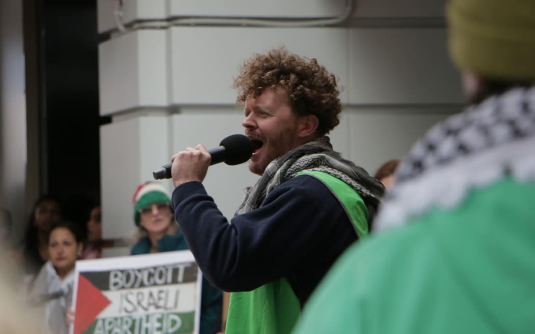 Ebbie Lifweard speaking at a Palestine protest in Wellington CBD