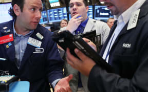 Traders work on the floor of the New York Stock Exchange (NYSE) following news that the United Kingdom has voted to leave the European Union on June 24, 2016 in New York City.