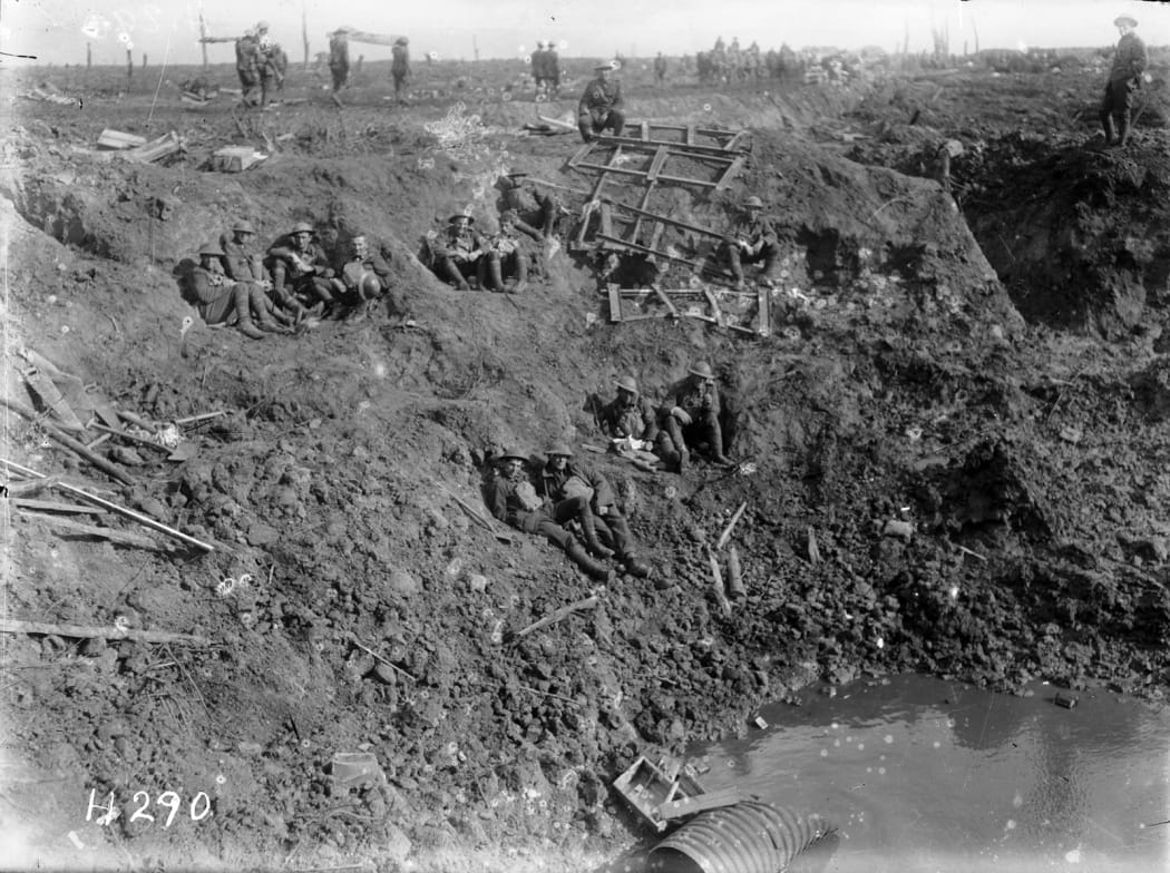 New Zealand Engineers resting in a large shell hole at Spree Farm, Ypres Salient, Belgium, 12 October 1917.