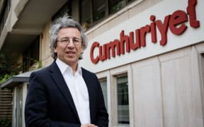Can Dundar, the editor-in-chief of Cumhuriyet daily, outside the newspaper's offices.