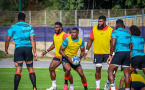 Jiuta Wainiqolo attacks with the ball at training.