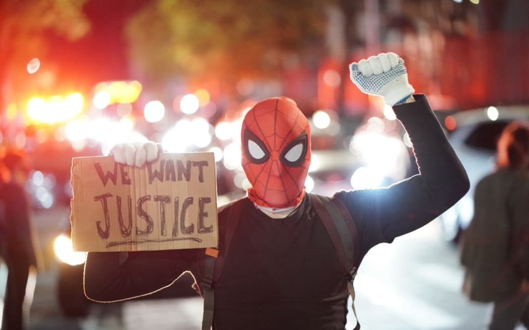 Protestor in a spiderman mask rally against the death of Minneapolis, Minnesota man George Floyd at the hands of polic.