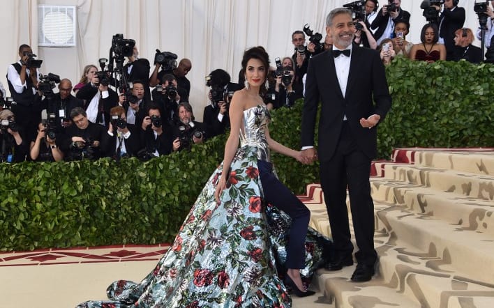 Amal Clooney and her husband actor George Clooney arrive for the 2018 Met Gala on May 7, 2018, at the Metropolitan Museum of Art in New York.