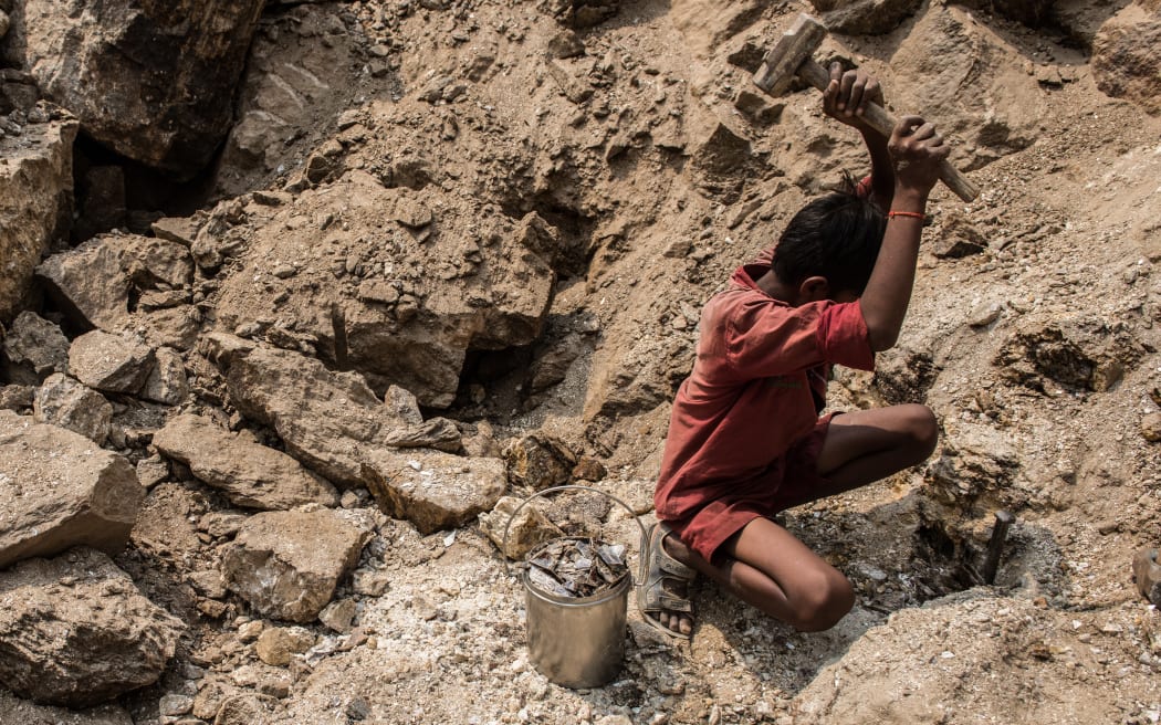 Boy mining mica