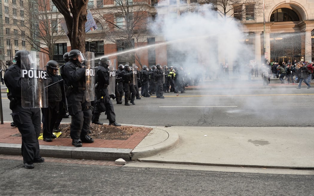Protesters clash with police in Washington streets as the inauguration of President Trump was being held at the Capitol.