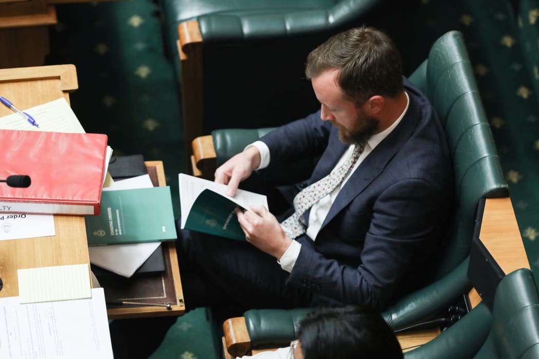 Kieran McAnulty consults his bible - Speakers' Rulings with Standing Orders waiting nearby
