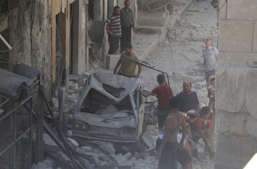 Aleppo residents search through debris after further air strikes on the city.
