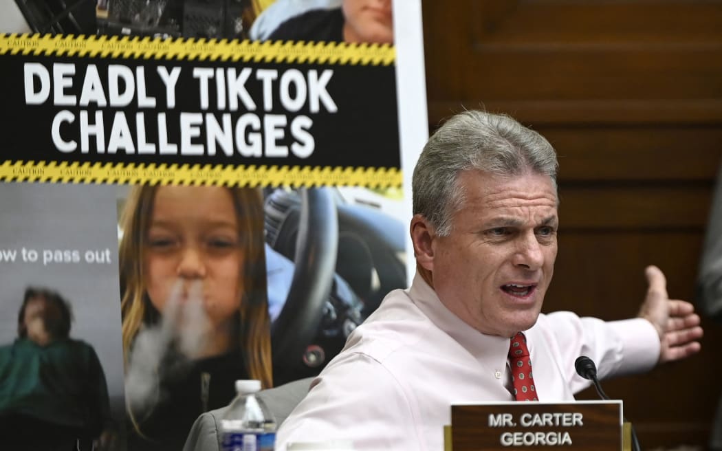 US Representative Buddy Carter from Georgia, questions TikTok chief executive Shou Zi Chew during a House Energy and Commerce Committee hearing on safeguarding Americans against issues tied to TikTok.