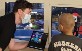Starship patients use iPad to light up Sky Tower.