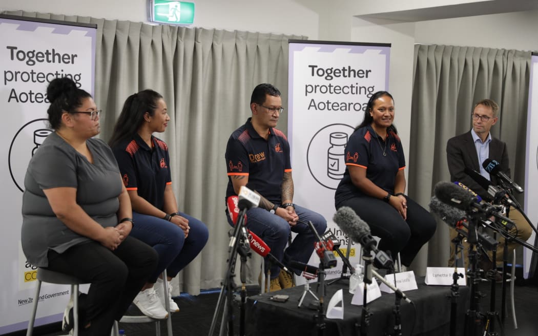 Some of the border workers to be vaccinated against Covid-19 and Director-General of Health Dr Ashley Bloomfield (right) at a media briefing.