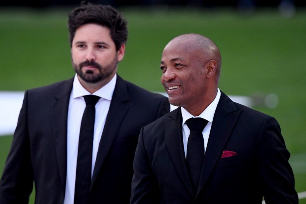 Former West Indies cricketer Brian Lara (R) arrives to attend the state memorial service for the former Australian cricketer Shane Warne at the Melbourne Cricket Ground (MCG) in Melbourne on March 30, 2022.