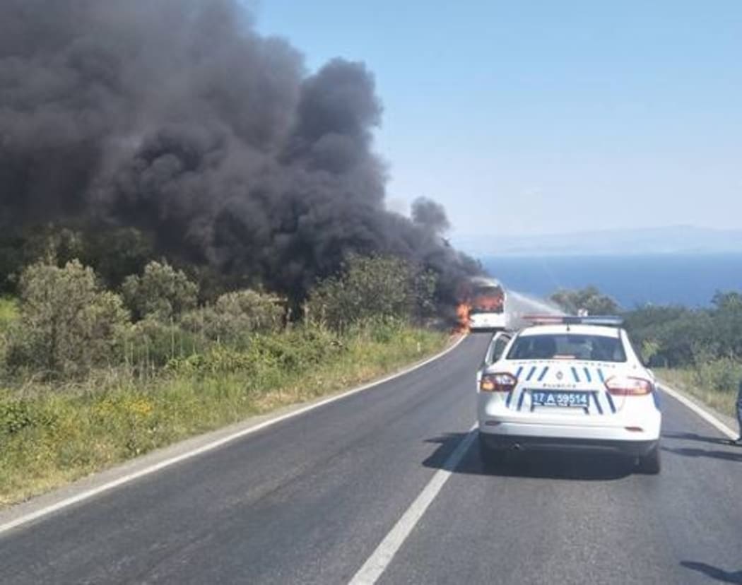 The bus on fire.