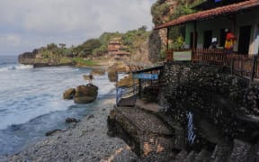 General view of Mbuluk Beach in Gunung Kidul, Yogyakarta, Indonesia, on July 24, 2025. Mbuluk Beach is located in Kemadang Village, Tanjungsari District, Gunungkidul Regency. The distance of this beach from the center of Yogyakarta City is about 62 km. Mbuluk Beach is one of the most popular natural tourist destinations in Gunungkidul Regency. (Photo by Algi Febri Sugita/NurPhoto) (Photo by Algi Febri Sugita / NurPhoto via AFP)