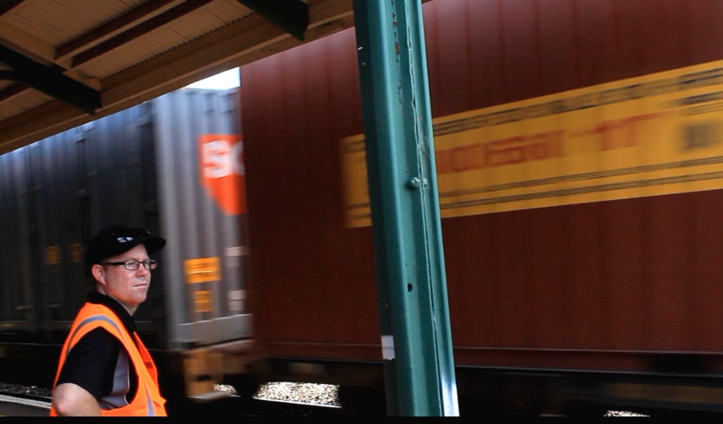 A photo of Jason Lawn watching a northbound train leave the Rangiora Station.