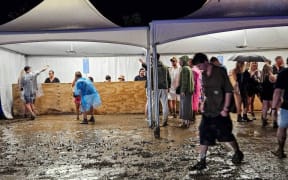 New Year's Eve festival-goers faced mud at the Highlife Festival at Ascension Wine Estate in Matakana.