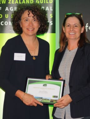 Journalist Carol Stiles receives an award from the NZ Guild of Agricultural Journalists and Communicators in 2017.