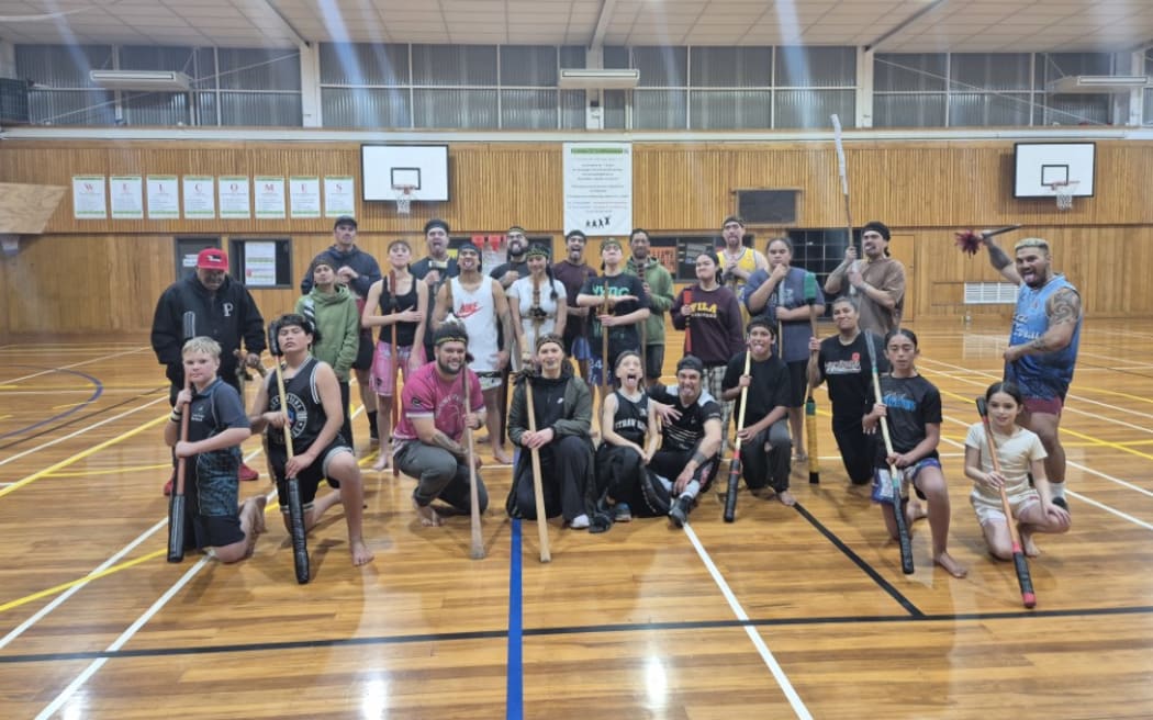 The class taking mau rākau lessons with taiaha at Karamū High School.