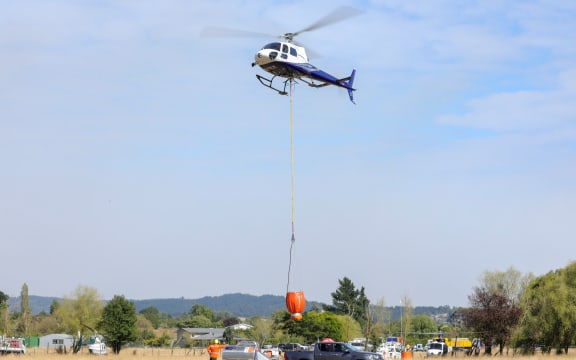 Water bombers refuel before returning to fight Nelson bushfires.