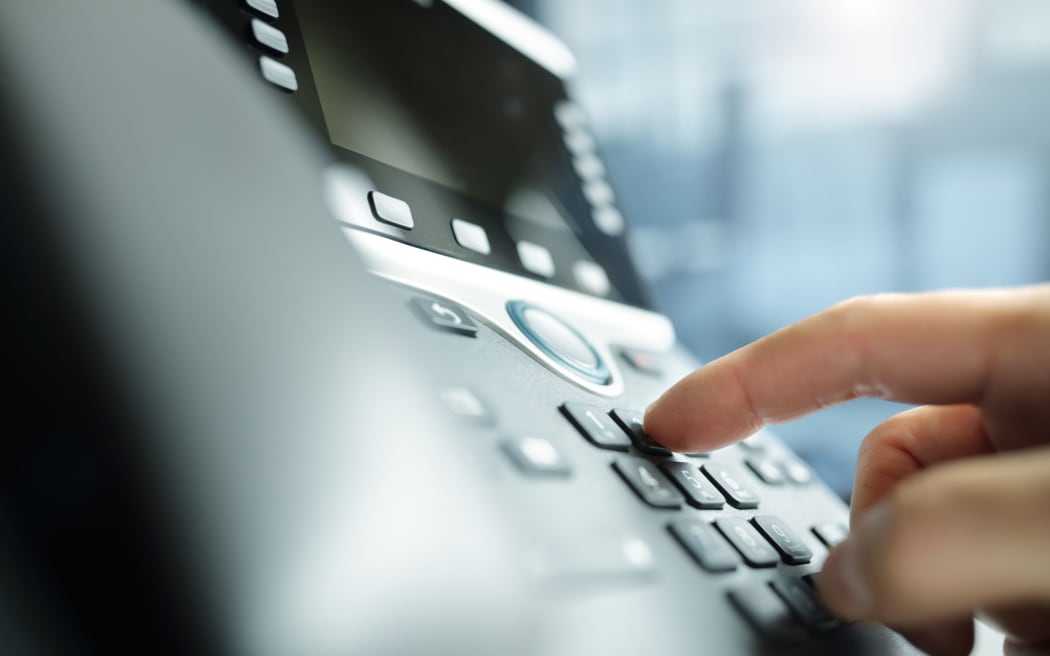 Dialing a telephone keypad.