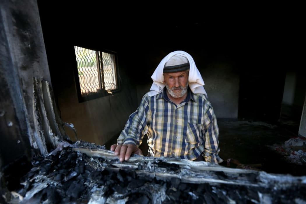 Debris of burned out buildings in the village of Duma in the northern West Bank district of Nablus.