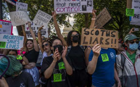 Abortion-rights activists protest in front of the US Supreme Court building in Washington DC.