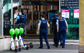 Police officers walk in Auckland CBD.