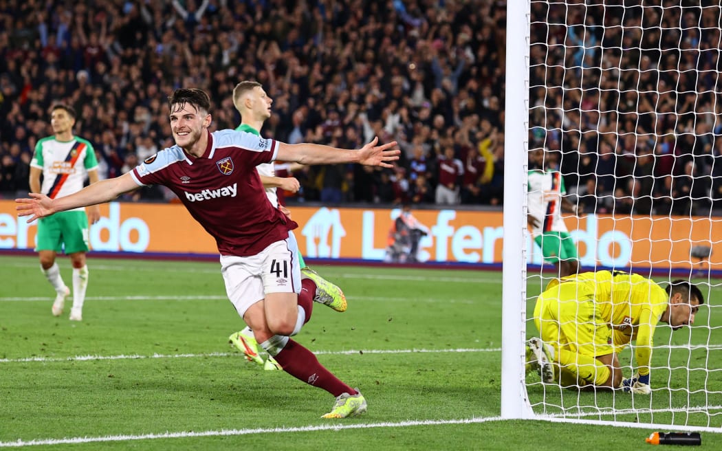 West Ham United's English midfielder Declan Rice celebrates scoring his team's first goal during the UEFA Europa League group H football match between West Ham United and Rapid Vienna at The London Stadium, in east London on September 30, 2021.