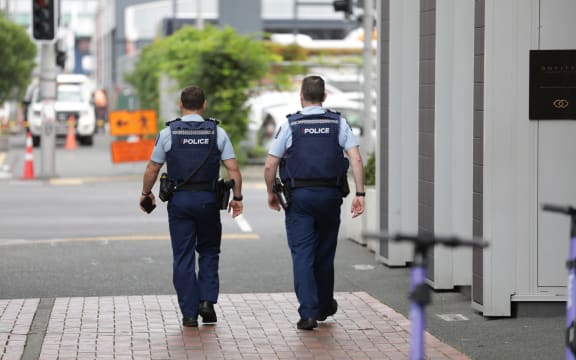 Police officers in Auckland's Viaduct Harbour following an incident at the Sofitel.