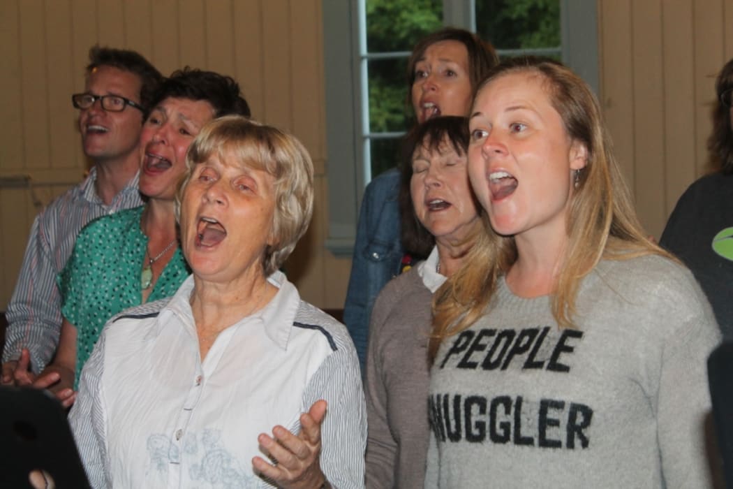 A photo of the Devonport World Song Choir in full cry.