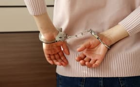 woman handcuffs / handcuffed